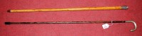 Lot 106 - A circa 1900 walking stick having a faux...