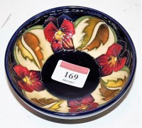 Lot 169 - A small modern Moorcroft pottery pin dish on a...