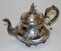 Lot 194 - A Victorian silver plated teapot the hinged...