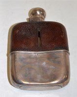 Lot 195 - An Edwardian glass bodied leather covered and...