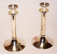 Lot 210 - A pair of modern silver table candle sticks,...
