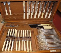 Lot 247 - An Edwardian oak cased 12-place setting...