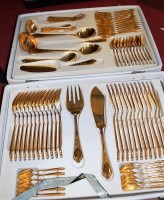 Lot 257 - A modern 12-place setting canteen of gold...