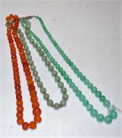 Lot 284 - A jade? beaded necklace having silver clasp...