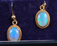 Lot 303 - A pair of 9ct gold cabochon opal set ear...