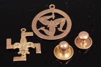 Lot 333 - A 9ct gold Manxmen pendant, swastika & fleur...