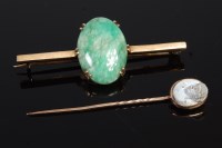 Lot 343 - A 9ct gold cabochon jade set bar brooch;...