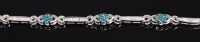 Lot 353 - A modern silver and diamond set bracelet, each...
