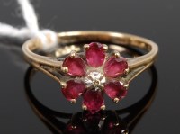 Lot 362 - A 9ct gold, ruby and diamond point set flower...