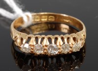 Lot 363 - An 18ct gold diamond five stone ring, the claw...
