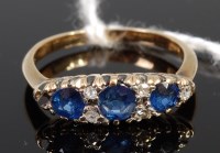 Lot 368 - An 18ct gold, sapphire and diamond ring, the...