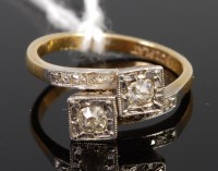 Lot 372 - An 18ct gold and platinum diamond crossover...