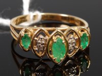 Lot 375 - A modern 14ct gold, emerald and diamond point...