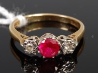 Lot 384 - An 18ct gold, ruby and diamond ring, arranged...