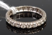 Lot 386 - An 18ct white gold diamond eternity ring,...