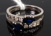 Lot 387 - An 18ct white gold, sapphire and diamond ring,...