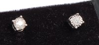Lot 396 - A pair of white metal diamond set ear studs,...