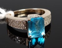 Lot 406 - A 14ct gold blue topaz dress ring, the...