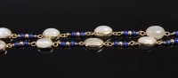 Lot 420 - An Arts & Crafts 9ct gold cabochon moonstone...