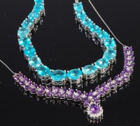 Lot 426 - A silver and blue zircon set necklace together...