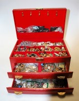 Lot 464 - A faux leather clad jewellery box and contents...