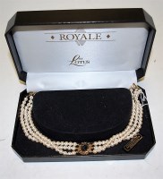 Lot 468 - A Lotus Royale simulated pearl three string...