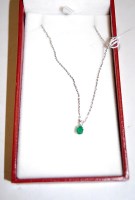 Lot 477 - An emerald and diamond set pendant (approx...