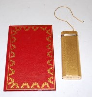 Lot 487 - A Cartier of Paris textured gilt pocket...