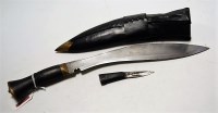 Lot 525 - A tourist kukri, having curved steel blade and...
