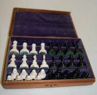 Lot 543 - A boxed and painted cast metal chess set