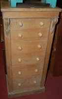 Lot 1310 - A Victorian light oak six drawer Wellington...
