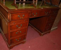 Lot 1312 - A reproduction mahogany and gilt tooled green...
