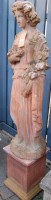Lot 1324 - A terracotta standing garden statue of a lady...