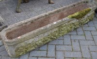 Lot 1331 - A reconstituted stone long garden trough,...