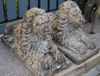 Lot 1333 - A pair of reconstituted stone garden figures...