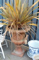 Lot 1335 - A terracotta pedestal twin handled campagna...
