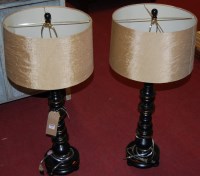 Lot 1269 - A pair of contemporary ebonised and gilt...