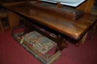 Lot 1270 - An oak trestle end dining table, length 178cm