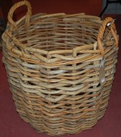 Lot 1275 - A large wicker twin handled circular log...