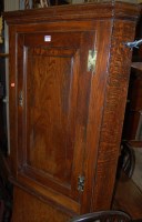 Lot 1297 - An early 19th century joined elm single door...