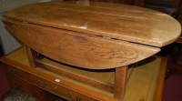 Lot 1299 - A moulded oak low dropflap coffee table,...