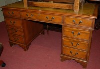 Lot 1300 - A reproduction yew wood and gilt tooled green...