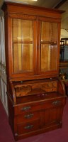 Lot 1306 - A Victorian cylinder secretaire bookcase,...