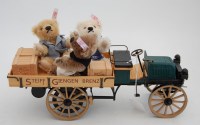 Lot 1526 - A Steiff delivery cart with teddy-bears,...