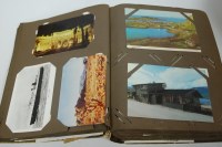 Lot 513 - An early 20th century postcard album, contents...