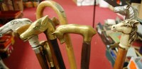 Lot 514 - A collection of walking canes and shooting...