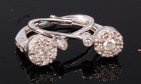 Lot 332 - A pair of 14ct white gold and diamond set ear...