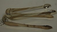 Lot 419 - A pair of George III silver sugar tongs...