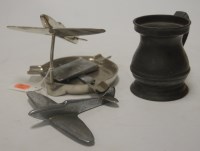 Lot 186 - A novelty chrome ashtray surmounted by an...