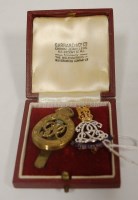 Lot 437 - A 9ct gold, white metal and enamelled lapel...